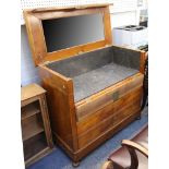 A German cherrywood and mahogany commode, Biedermeier c.1840, the hinged top opening to reveal the