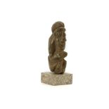 A NOMOLI STONE FIGURE, SIERRE LEONE The stylised figure, depicted crouching, 16cm high Provenance: