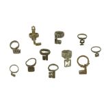 TWELVE ROMAN BRONZE KEY RINGS Circa 1st-3rd Century A.D. Each of ring and key form, with different