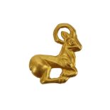 A ZIWIYE GOLD ATTACHMENT Circa 8th-7th Century B.C. In the form of a recumbant ibex, 2cm high