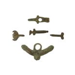 FIVE ROMAN BRONZE PHALLIC AMULETS Circa 1st-2nd Century A.D. Each with male genetalia with