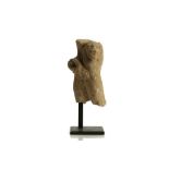 A CYPRIOT LIMESTONE FRAGMENT OF HERAKLES AND THE NEMEAN LION Circa 6th Century B.C. Showing the nude