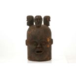 AN AFRICAN WOODEN HELMET MASK, EJAGHAM-STYLE Of Janus-form, the face carved on the obverse with