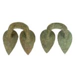 A PAIR OF ETRUSCAN BRONZE STAMNOS HANDLES Circa 5th-4th Century B.C. The attachment plates in the