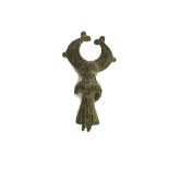 A CELTIC BRONZE FIGURAL BROOCH Circa 2nd Century A.D. The draped figure, with arms by her side and