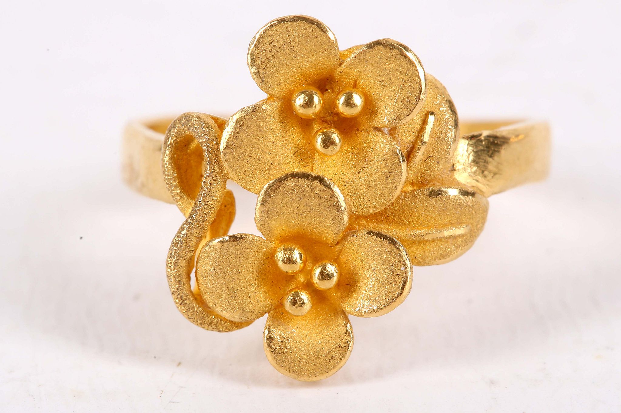 A flower ring, The two brushed flowerheads, stamped '9999', ring size L, approx. weight 4.7 grams. - Image 2 of 3