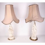 A pair of 19th Century Continental white bisque figures, modelled as a boy and girl, and presented