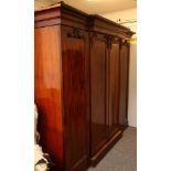 Victorian mahogany triple section breakfront wardrobe circa 1850. The concave cornice above a pair