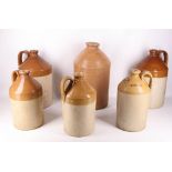 A collection of six glazed stoneware cider or spirit flasks, to include a pair by Doulton Lambeth,