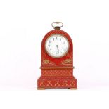 An Edwardian red laquer finished dome top mantle clock with chinoserie decoration, white face and