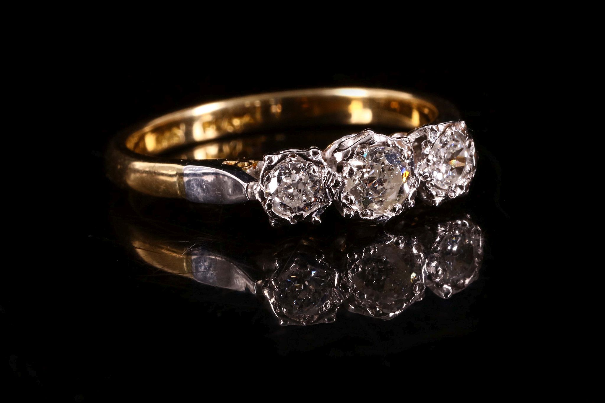 A three-stone diamond ring Set with a trio of brilliant-cut diamonds, diamonds approx. 0.55ct total,