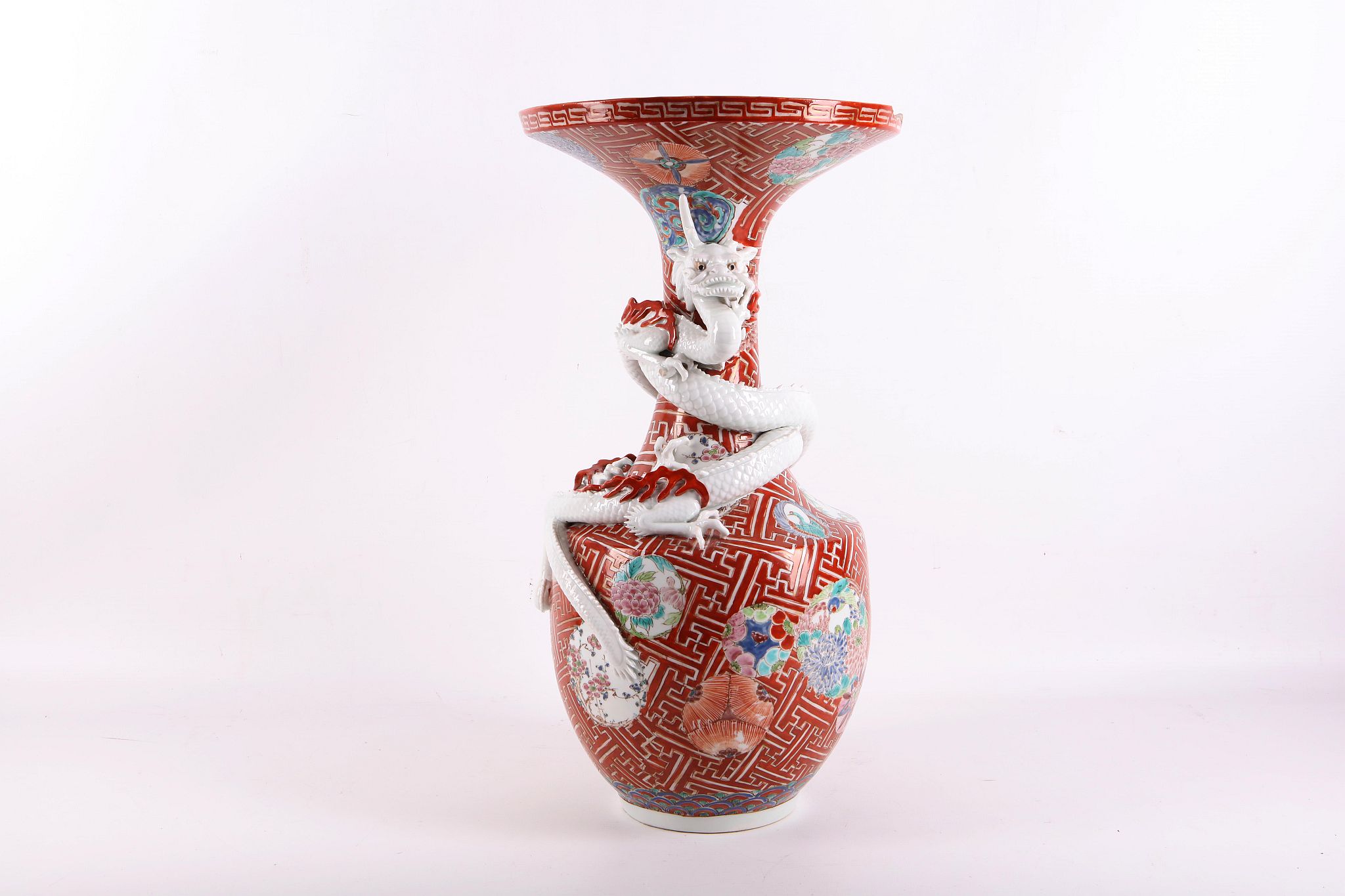 A late 19th Century Japanese export porcelain Imari, baluster shaped vase, surrounded by two blanc-