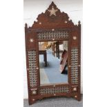 A Syrian mirror with wood frame, 120cm high.