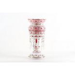 A single Edwardian Bohemian cranberry and cased glass lustre, 33cm high.