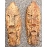 A pair of oceanic wood carvings, 63cm high (2).