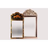 A chinoiserie style mirror in black with gilt decoration, inset decorated panel to top, 91.5cm