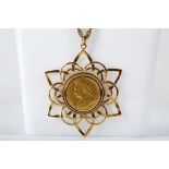 A Victorian full sovereign dated 1900, fitted in a 9ct gold gothic style mount and suspended from