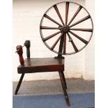 A late 18th / 19th Century spinning wheel, comprising a thick oak table a mounted wheel, supported