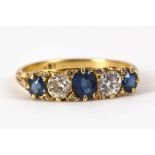 A Victorian style 18ct yellow gold, sapphire and diamond set graduated five stone ring.