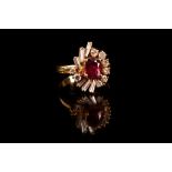 A ruby and diamond dress ring The oval-cut ruby, within a surround of tapered baguette and