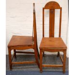 A pair of early 20th century Arts and Crafts oak hall chairs (2)