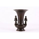 A 19th Century Meiji bronze flower vase, having figures as handles to either sides, 16.5cm high.
