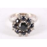 A sapphire and diamond cluster ring, Set with circular-cut sapphires and brilliant-cut diamonds,