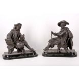 A pair of 19th century good spelter figures of French Noblemen, both raised on wooded bases in