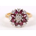 A garnet and diamond cluster ring, Set with circular-cut garnets and brilliant-cut diamonds, mounted