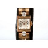 A Ladies vintage 18ct gold 'Doxa' cocktail watch with silvered dial, diamond set articulated