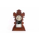 An Ansonia mantle clock fretted case, glass fronted, 56cm high.