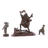 Three Indian bronze figures as follows: Hindu figure with skulls standing on a recumbent figure,