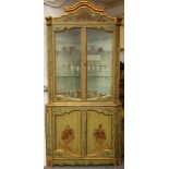 A 19th century Italian painted standing corner cupboard, with parcel-gilt decoration and painted