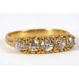 I Victorian style 18ct yellow gold and diamond set graduated five stone ring with pierced and scroll