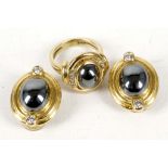 A pair of gold and haematite earrings with clasp-backs, together with a matching ring, marked 'D &