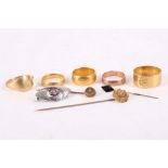 A collection of jewellery: Four band rings, of 9, 18 and 22 carat gold, one set with a cushion-