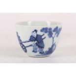 A Chinese blue and white tea cup with figurative decoration, Kangxi mark to base, 4.5cm high