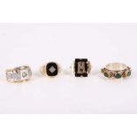 A collection of rings, Including two onyx rings, a gent's ring set with moissanites and a