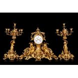 A LATE 19TH CENTURY FRENCH GILT BRONZE ROCOCO REVIVAL CLOCK GARNITURE the ornate case cast with C