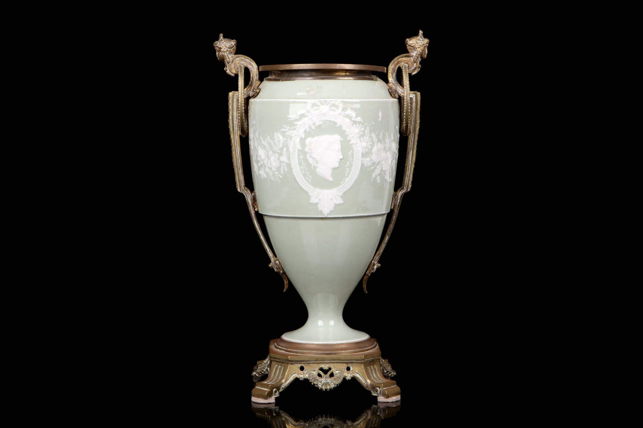 A LATE 19TH CENTURY PATE-SUR-PATE TYPE CELADON URN WITH GILT BRONZE MOUNTS of baluster form, the
