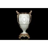A LATE 19TH CENTURY PATE-SUR-PATE TYPE CELADON URN WITH GILT BRONZE MOUNTS of baluster form, the