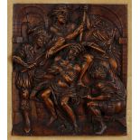 A 17TH CENTURY GERMAN BOXWOOD RELIEF CARVED PANEL DEPICTING THE MOCKING OF CHRIST Christ seated with