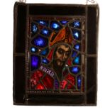 A 19TH CENTURY STAINED GLASS PANEL DEPICTING A SAINT of rectangular form, the saint with a long
