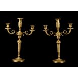 A PAIR OF 19TH CENTURY FRENCH RESTAURATION PERIOD GILT BRONZE THREE LIGHT CANDELABRA each with