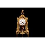 A LATE 19TH CENTURY FRENCH GILT BRONZE AND ENAMEL MOUNTED MANTEL CLOCK the case surmounted by an