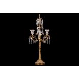 A REGENCY STYLE GILT METAL AND CUT GLASS LAMP BASE the central stem modelled with a dolphin