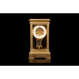 A LATE 19TH CENTURY FRENCH GILT BRONZE AND FOUR GLASS MANTEL CLOCK of typical form, the corners with