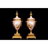 A PAIR OF LATE 19TH / EARLY 20TH CENTURY FRENCH SEVRES STYLE AND GILT BRONZE MOUNTED URNS the