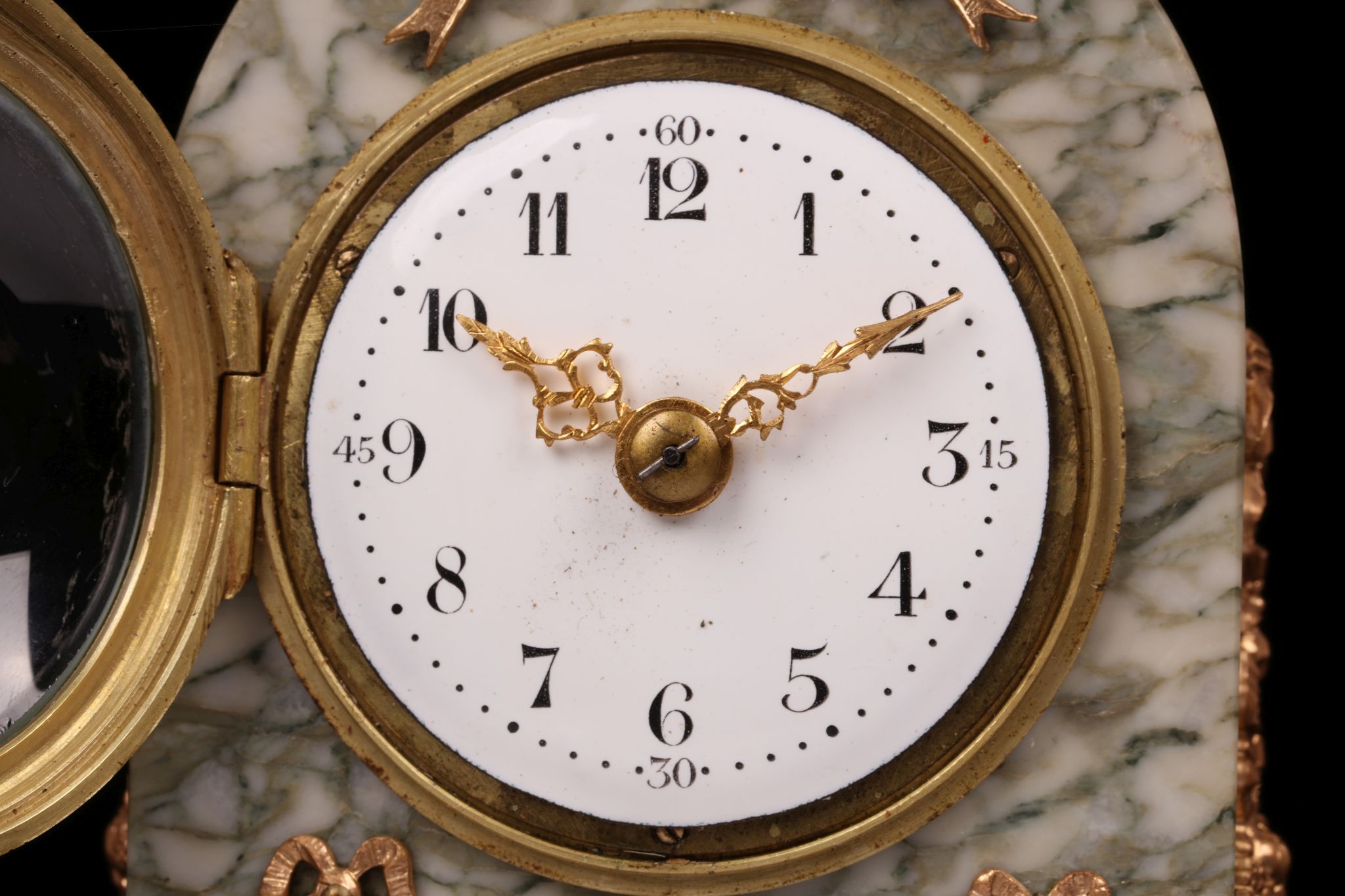 A LATE 19TH CENTURY FRENCH MARBLE AND GILT BRONZE MOUNTED BOUDOIR CLOCK the arched case surmounted - Image 2 of 7