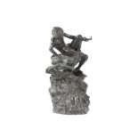 AN EARLY 20TH CENTURY BRONZE FIGURAL GROUP OF ALADDIN AND THE GENIE the seated, nude figure of
